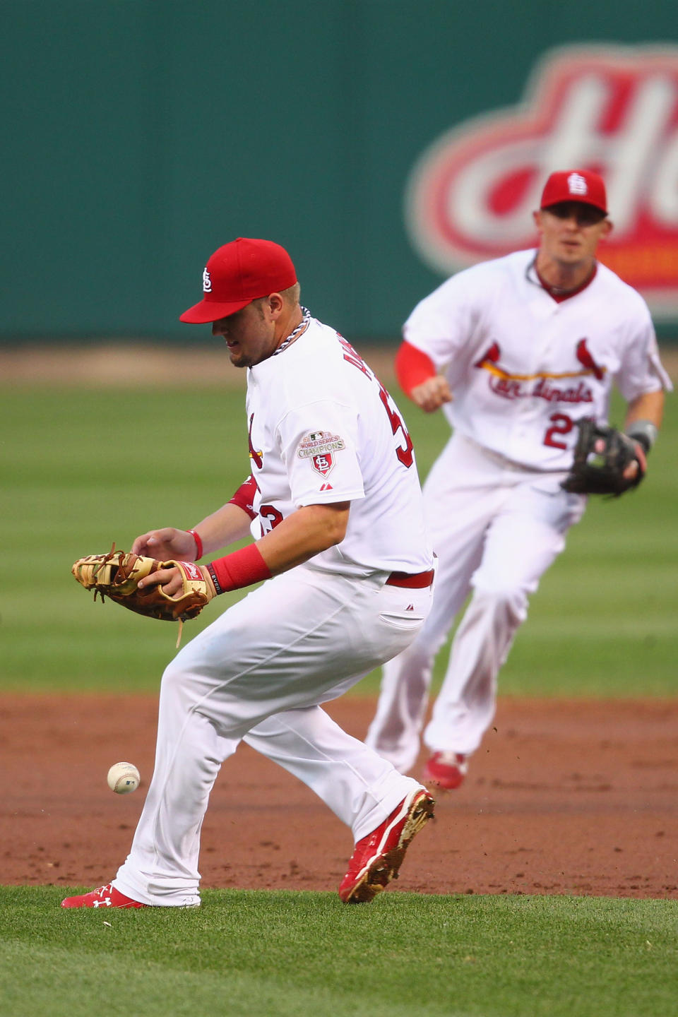 ST. LOUIS, MO - MAY 25: Matt Adams #53 of the St. Louis Cardinals misplays a ground ball to allow a run against the Philadelphia Phillies at Busch Stadium on May 25, 2012 in St. Louis, Missouri. (Photo by Dilip Vishwanat/Getty Images)