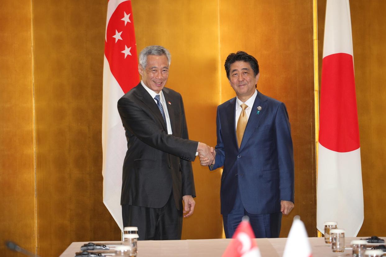 Singapore Prime Minister Lee Hsien Loong and Japanese PM Shinzo Abe meeting at the 2019 G20 Summit in Osaka. (PHOTO: Ministry of Communications and Information)