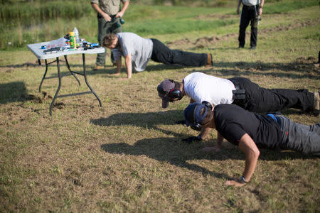 Trainees practice push-up exercises as a part of a special tactic called "shooting after effort", which is part of the Cherev Gidon Firearms Training Academy in Honesdale, Pennsylvania, U.S. August 5, 2018. REUTERS/Noam Moskowitz