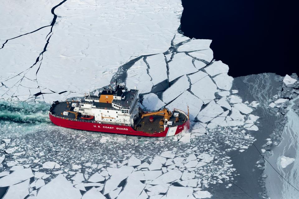 The USCGC Mackinaw breaks ice as part of the Coast Guard's annual ‘Spring Break Out’ to prepare regional waterways for tanker movements on March 16, 2022 on Green Bay northeast of Marinette, Wisconsin.