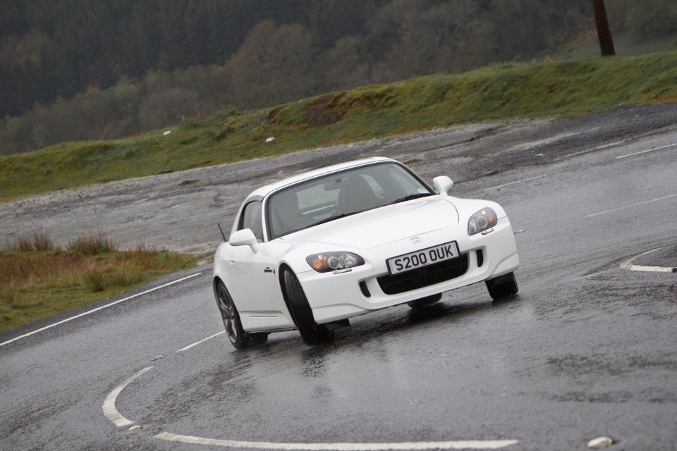 <p>Shorter than a Mini Clubman, lighter than a Lotus Emira (at a scant 1250kg) and with a reasonable 2.0-litre displacement, the S2000 <strong>doesn’t sound like a recipe for high emissions</strong>. But, alas, it is, and as such all cars registered after March 2006 will be £710 a year in tax.</p><p>Luckily that leaves plenty of earlier models with a lower tax bill, and even some AP2 facelifts which arrived in 2004, dodge the ULEZ charge and are distinguished by their 17in alloys and LED taillights. Under the skin, rigidity was improved and a 2.2-litre engine was introduced for the US and Japan – a quick way to check if one you’re looking at is an import. </p>