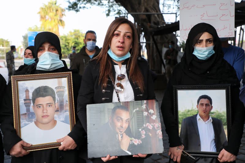 Samia Doughan holds a picture of her husband Mohammad, 48, who was killed in the explosion at the Port of Beirut