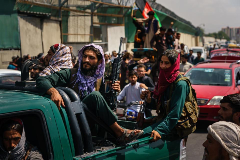 Armed Afghans in a truck in Kabul, Afghanistan.