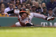 Baltimore Orioles' Kyle Stowers slides safe at home after Orioles' Adley Rutschman grounded out in the third inning of a baseball game against the Boston Red Sox, Thursday, Sept. 29, 2022, in Boston. (AP Photo/Steven Senne)