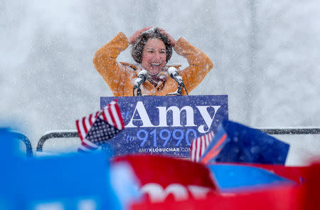 FILE PHOTO: U.S. Senator Amy Klobuchar brushes snow from her hair after announcing her candidacy for the 2020 Democratic presidential nomination in Minneapolis, Minnesota, U.S., February 10, 2019. REUTERS/Eric Miller/File Photo