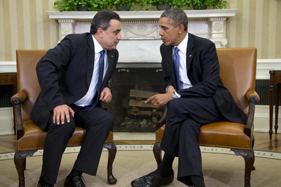 President Barack Obama meets with Tunisian Prime Minister Mehdi Jomaa, Friday, April 4, 2014, in the Oval Office of the White House in Washington. (AP Photo/Carolyn Kaster)