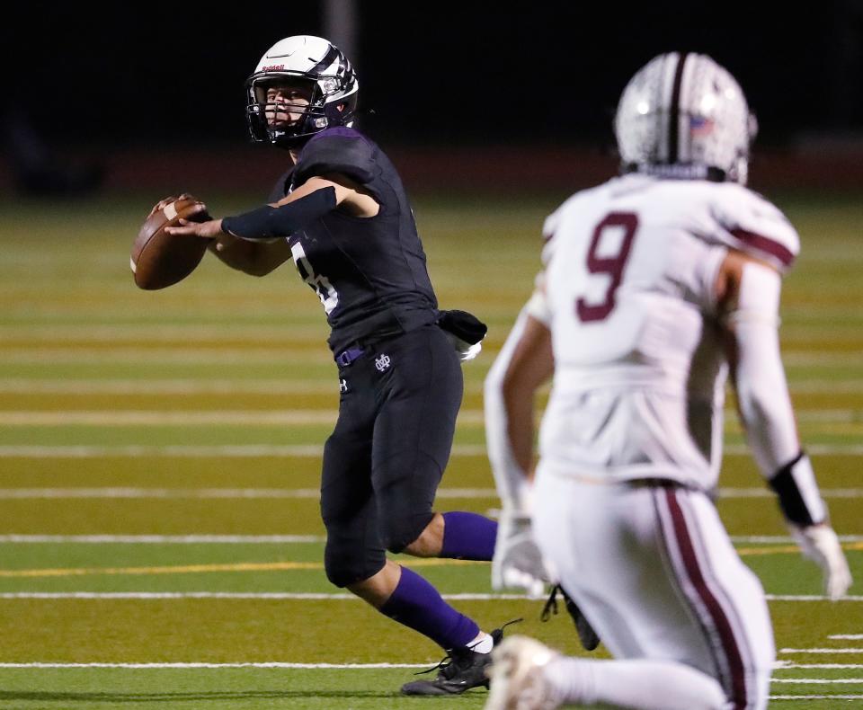 Mission Oak's Daniel Gonzalez looks for receivers against Mt. Whitney's Mario Rodriguez during their Central Section Division III high school quarterfinal football game in Tulare, Calif, Thursday, Nov. 9, 2023.