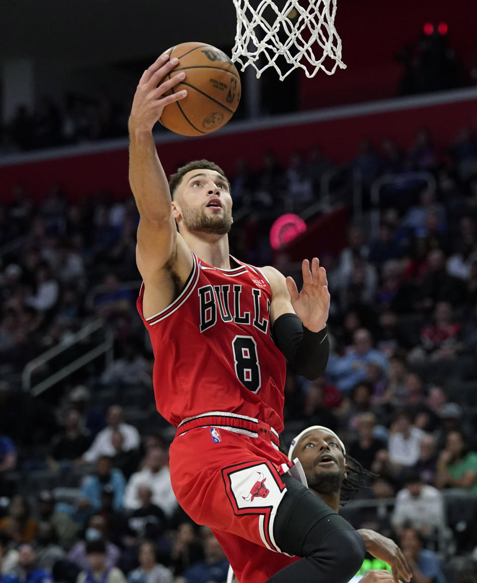 Chicago Bulls guard Zach LaVine (8) makes a layup during the second half of an NBA basketball game against the Detroit Pistons, Wednesday, Oct. 20, 2021, in Detroit. (AP Photo/Carlos Osorio)