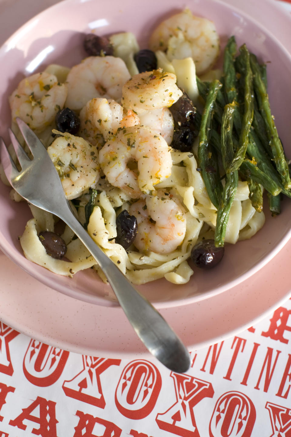 This Jan. 13, 2014 photo shows honey peppered roasted shrimp with green beans and olives in Concord, N.H. (AP Photo/Matthew Mead)