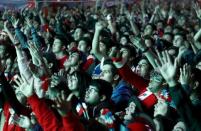 Chilean soccer fans watch the Copa America 2015 final soccer match between Chile and Argentina at a fan fest in Santiago, Chile, July 4, 2015. REUTERS/Mariana Bazo