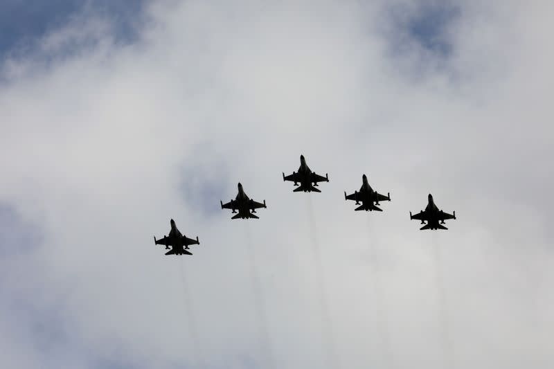 FILE PHOTO: Taiwanese F-16 fighter jets fly in formation during an inauguration ceremony in Taichung, Taiwan