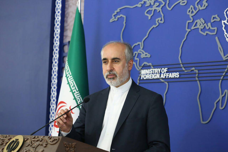 In this photo released on Thursday, Aug. 11, 2022, by the Iranian Foreign Ministry, Foreign Ministry spokesperson Nasser Kanaani speaks in Tehran, Iran. Kanaani denied on Monday, Aug. 15, 2022, that Tehran was involved in the assault on author Salman Rushdie, in remarks that were the country's first public comments on the attack. (Iranian Foreign Ministry via AP)