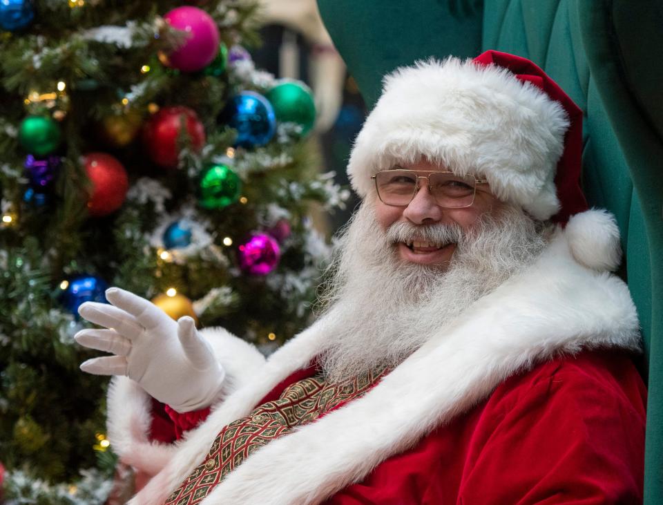 Santa Claus sits in his big chair at the Solomon Pond Mall Thursday, November 25, 2021.