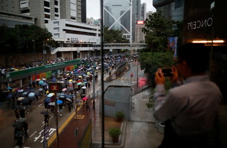 People march during a rally to demand democracy and political reforms in Hong Kong