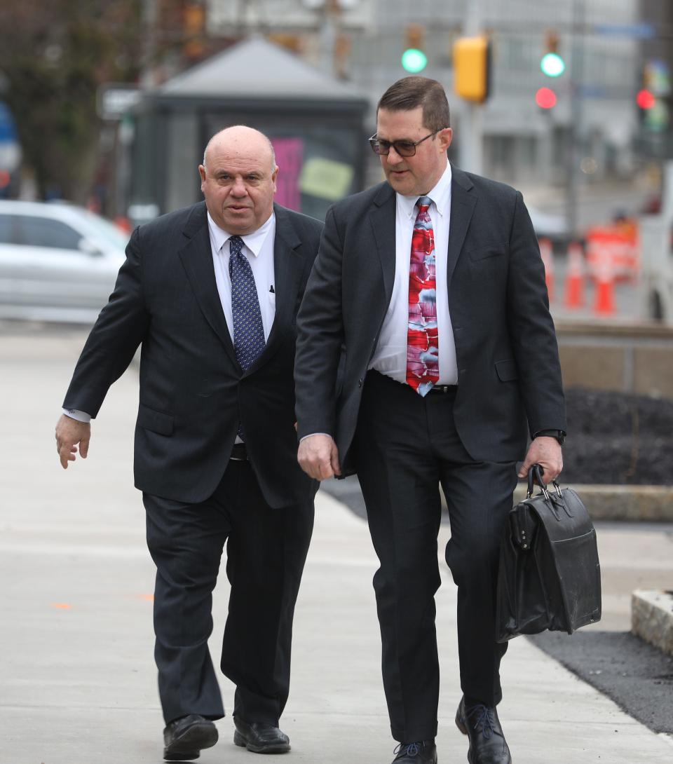 Michael Tremiti (l) walks into court with his attorney, Don Thompson, at an earlier hearing in Rochester.