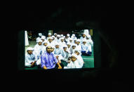 <p>A resident shows a pictures of some of the student in religious school Darul Quran Ittifaqiyah before a fire broke out early morning on his smartphone on Sept. 14, 2017 in Kuala Lumpur, Malaysia. (Photo: Mohd Samsul Mohd Said/Getty Images) </p>