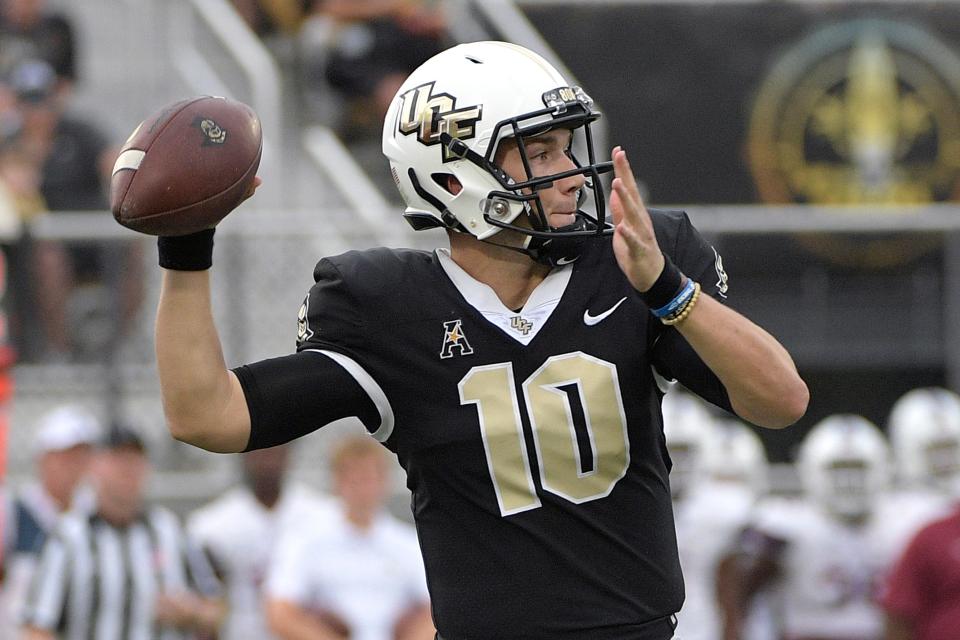 Central Florida quarterback McKenzie Milton (10) throws a pass during the first half of an NCAA college football game against South Carolina State Saturday, Sept. 8, 2018, in Orlando, Fla. (AP Photo/Phelan M. Ebenhack)