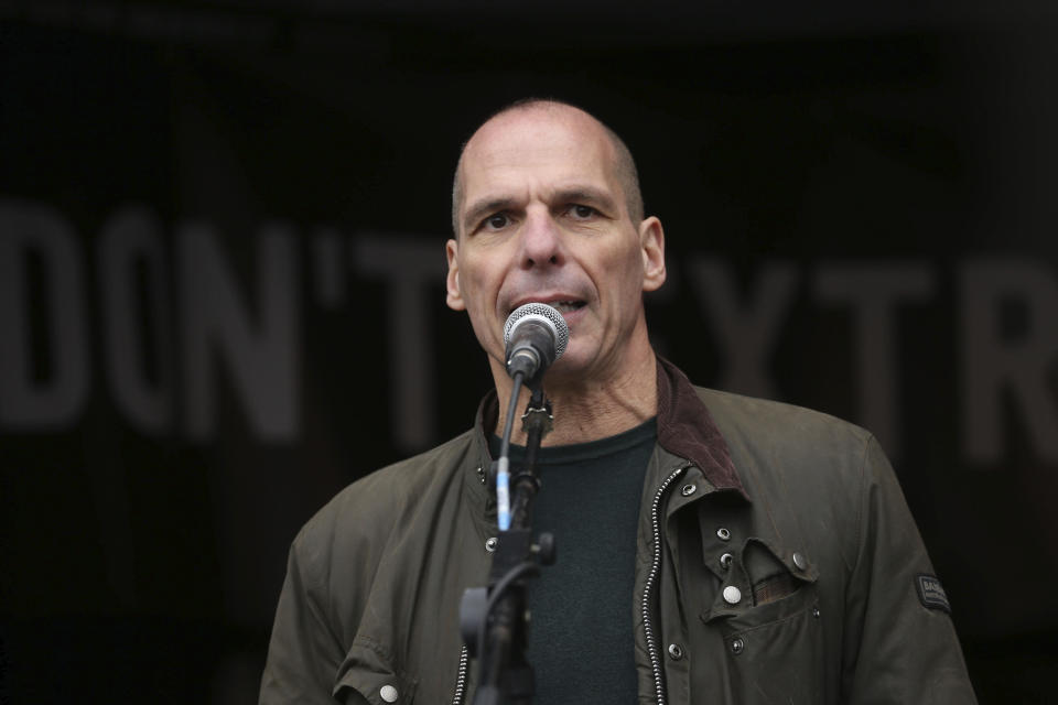 Former Greek economist politician Yanis Varoufakis speaks to crowds gathered at Parliament Square in London, protesting against the imprisonment and extradition of Wikileaks founder Julian Assange extradition, Saturday Feb. 22, 2020. (Isabel Infantes/PA via AP)