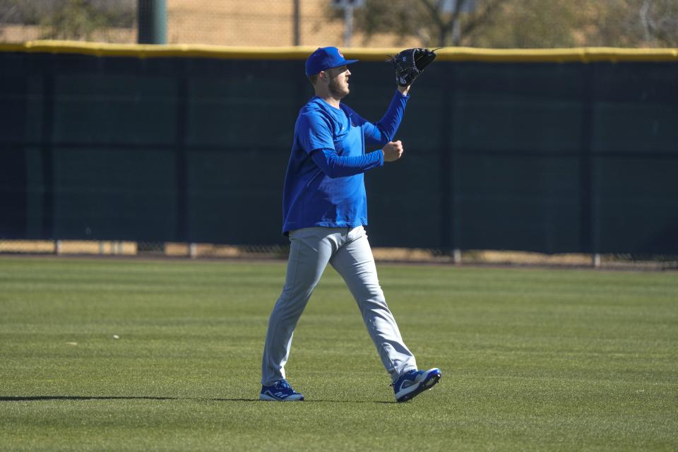 Chicago Cubs' Jameson Taillon catches a ball during a spring training baseball workout Wednesday, Feb. 15, 2023, in Mesa. (AP Photo/Morry Gash)