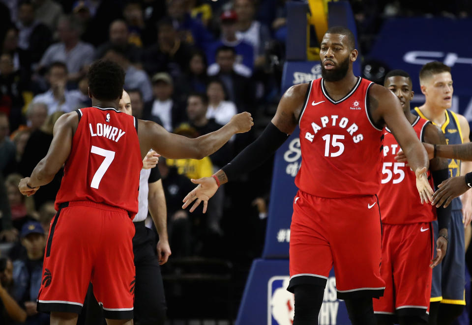 OAKLAND, CA - DECEMBER 12:  Greg Monroe #15 of the Toronto Raptors is congratulated by Kyle Lowry #7 after he was fouled by the Golden State Warriors at ORACLE Arena on December 12, 2018 in Oakland, California.  NOTE TO USER: User expressly acknowledges and agrees that, by downloading and or using this photograph, User is consenting to the terms and conditions of the Getty Images License Agreement.  (Photo by Ezra Shaw/Getty Images)