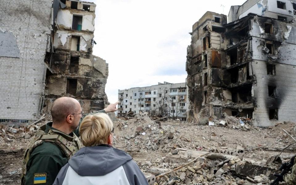 Lithuanian Prime Minister Ingrida Simonyte and her Ukrainian counterpart Denys Shmyhal visit the town of Borodianka, Ukraine on April 11, 2022. - Ukrainian Governmental Press Service/Reuters