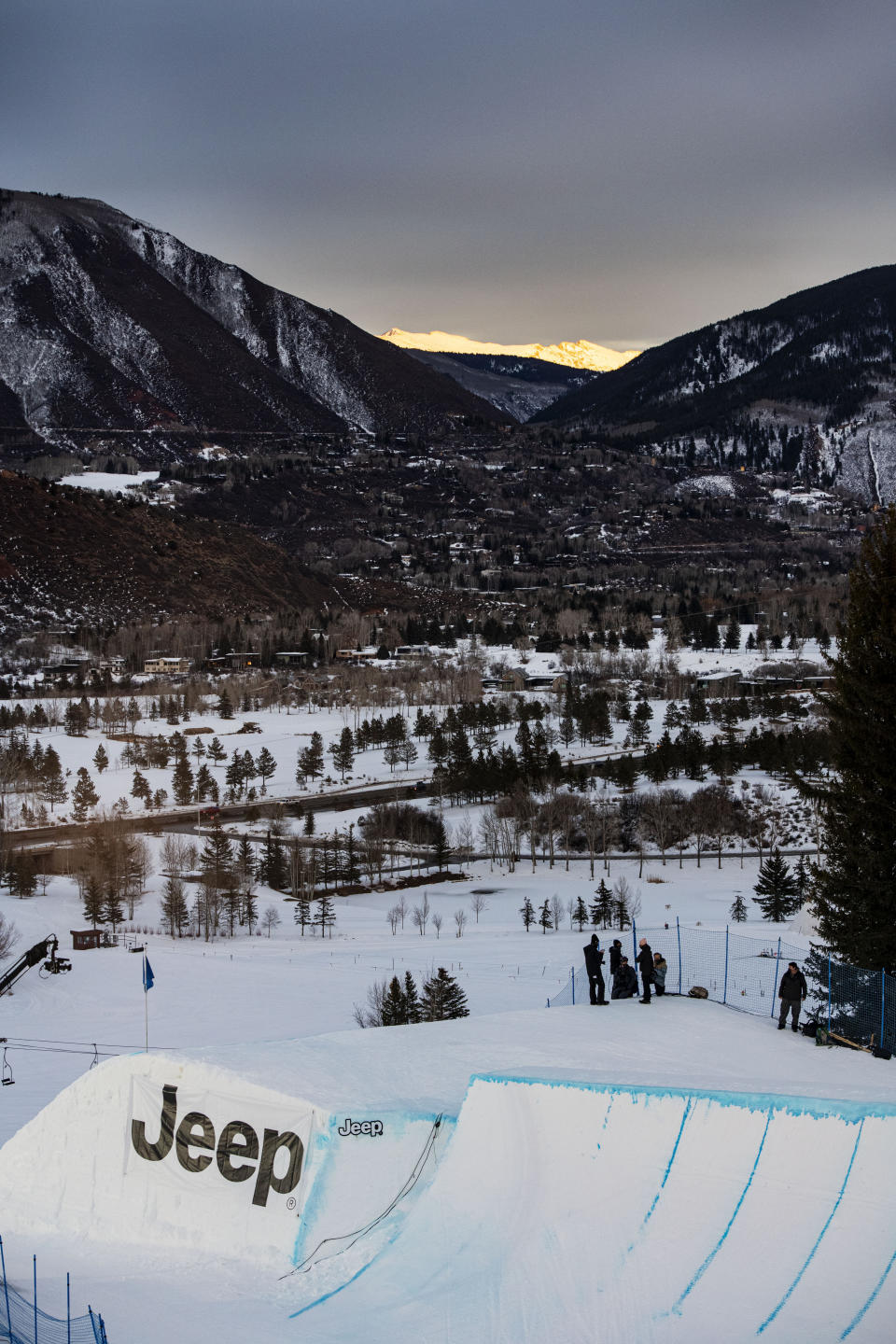 The sun sets during the knuckle huck and big air ski practice for the Winter X Games at Buttermilk on Thursday, Jan. 28, 2021, in Aspen, Colo. (Kelsey Brunner/The Aspen Times via AP)