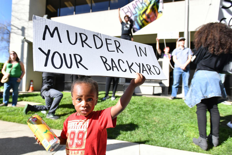 <p>Jayceon Hurtz, 2, holds a sign as Black Lives Matter protesters rally in response to the police shooting of Stephon Clark in Sacramento, Calif., on March 28, 2018. (Photo: Josh Edelson/AFP/Getty Images) </p>