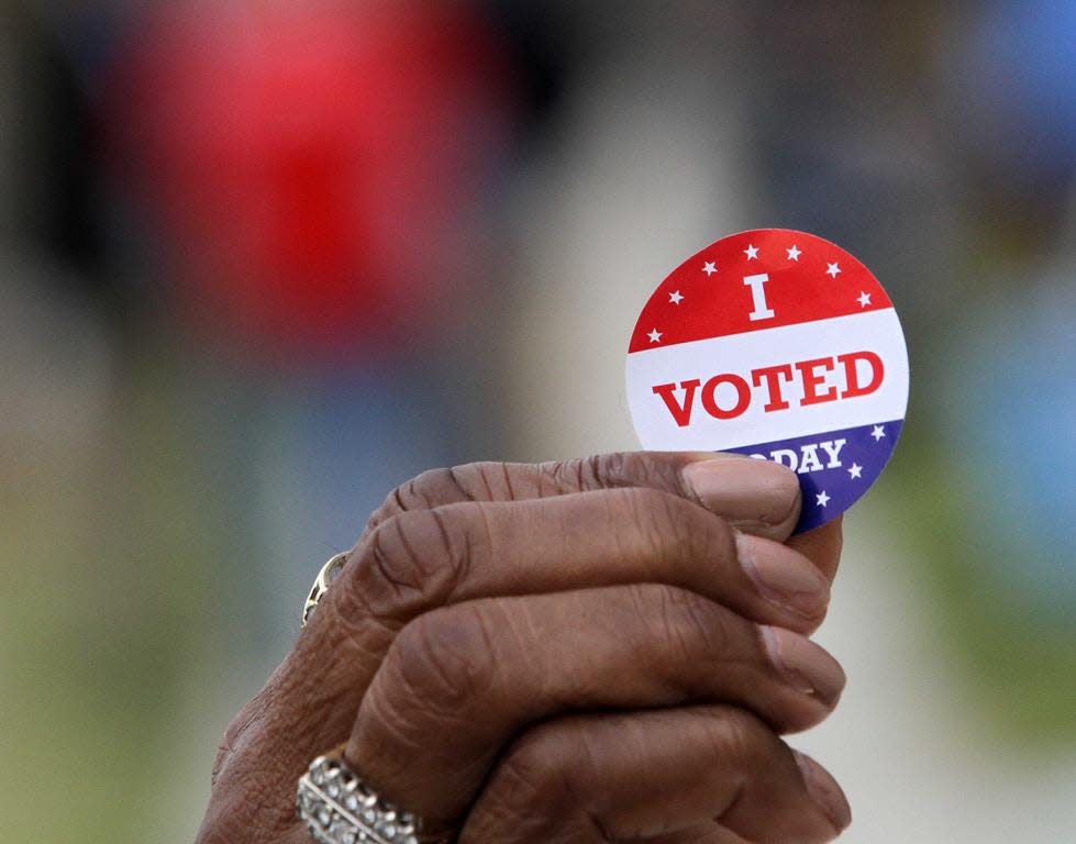 Local polling stations are busy with campaign signs, campaign workers and voters supporting their favorite candidates for office on primary election day in New Bern, N.C., March 3, 2020. [Gray Whitley / Sun Journal Staff]