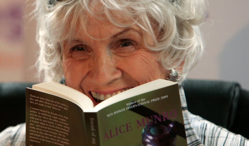 Munro holds one of her books as she receives her Man Booker International award at Trinity College Dublin, on June 25, 2009.<span class="copyright">Peter Muhly—AFP/Getty Images</span>