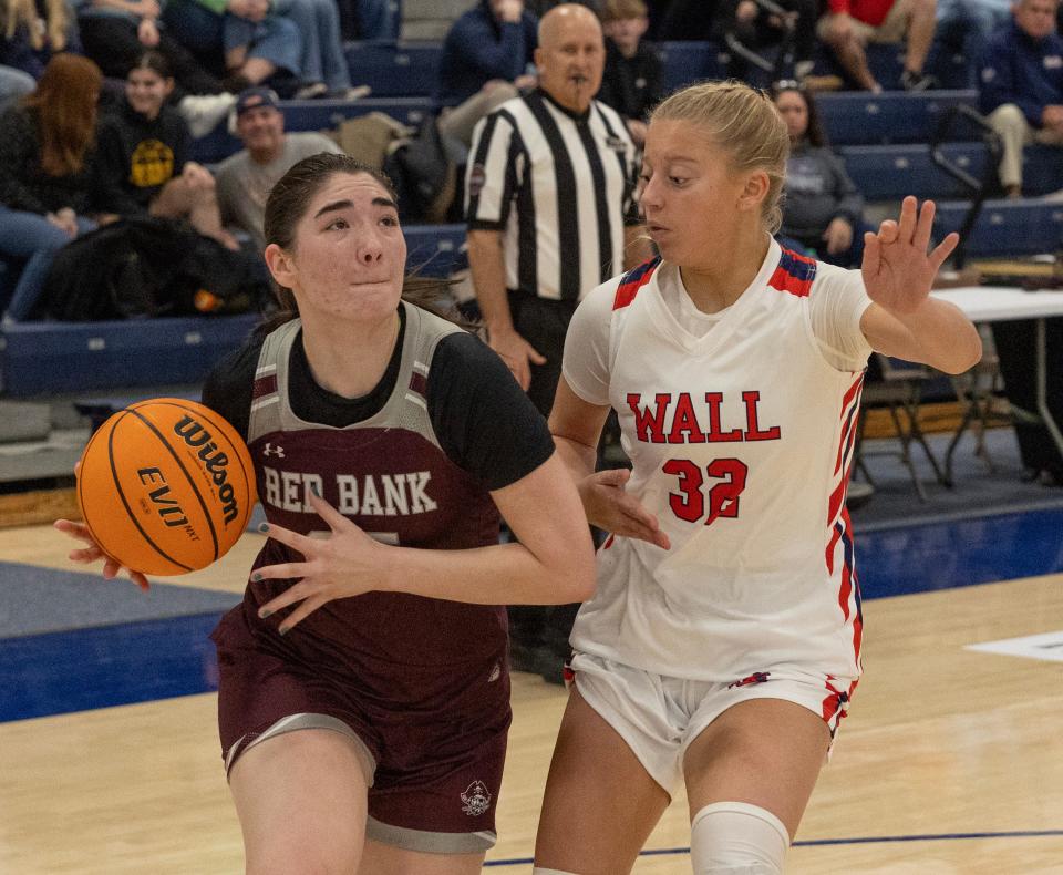 Red Bank Zoey Gulley drives to the basket against Wall Grace Holobinko. Red Bank Regional Girls Basketball defeats Wall 54-51 in WOBM Christmas Classic Cervino Final on December 30, 2023 in Toms River NJ.