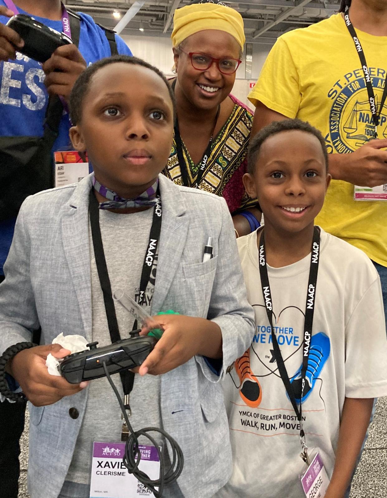 Twin brothers Xavier and George Clerisme with their mother, Linda Marc-Clerisme of Milton, attended the NAACP convention Friday in Boston.