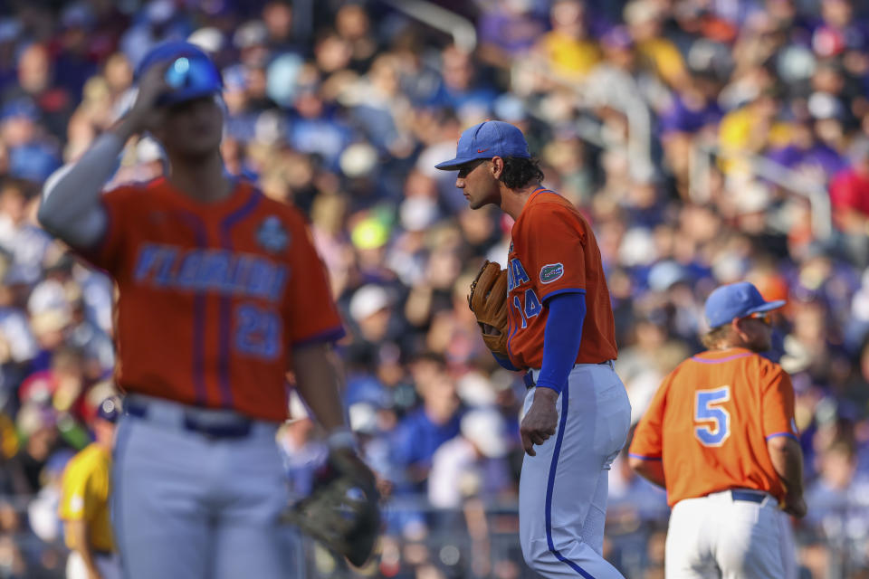 Florida pitcher Jac Caglianone (14) walks on the mound after loading the bases in the second inning of Game 3 of the NCAA College World Series baseball finals against LSU in Omaha, Neb., Monday, June 26, 2023. (AP Photo/Rebecca S. Gratz)