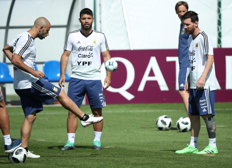 Big names: Messi prepares for Argentina’s next game with Javier Mascherano and Sergio Aguero. (REUTERS/Albert Gea)
