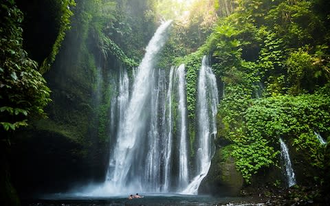 The island has a similar green heart to Bali but also has impressive waterfalls - Credit: Getty