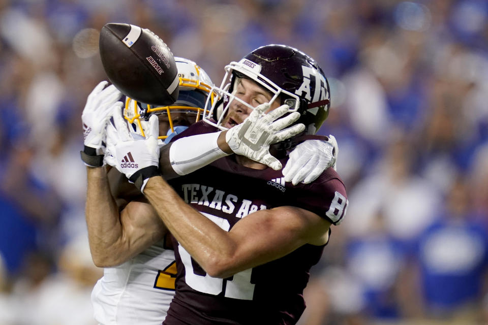 Texas A&M wide receiver Caleb Chapman (81) has the ball knocked away from him by Kent State cornerback Montre Miller, left, for an incomplete pass during the first half of an NCAA college football game on Saturday, Sept. 4, 2021, in College Station, Texas. (AP Photo/Sam Craft)
