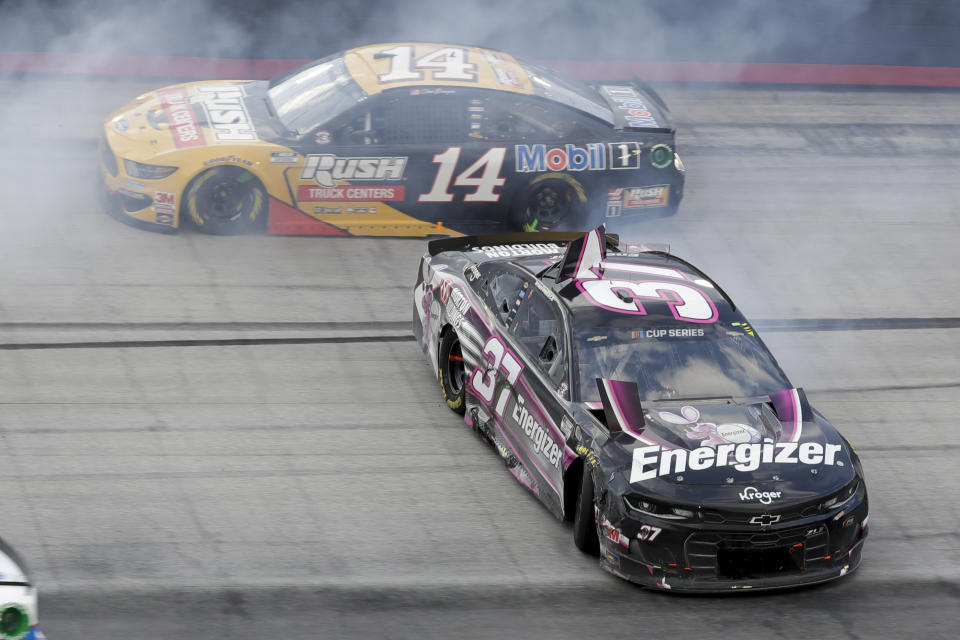 Ryan Preece (37) spins past Clint Bowyer (14) after a cash during a NASCAR All-Star Open auto race at Bristol Motor Speedway in Bristol, Tenn, Wednesday, July 15, 2020. (AP Photo/Mark Humphrey)