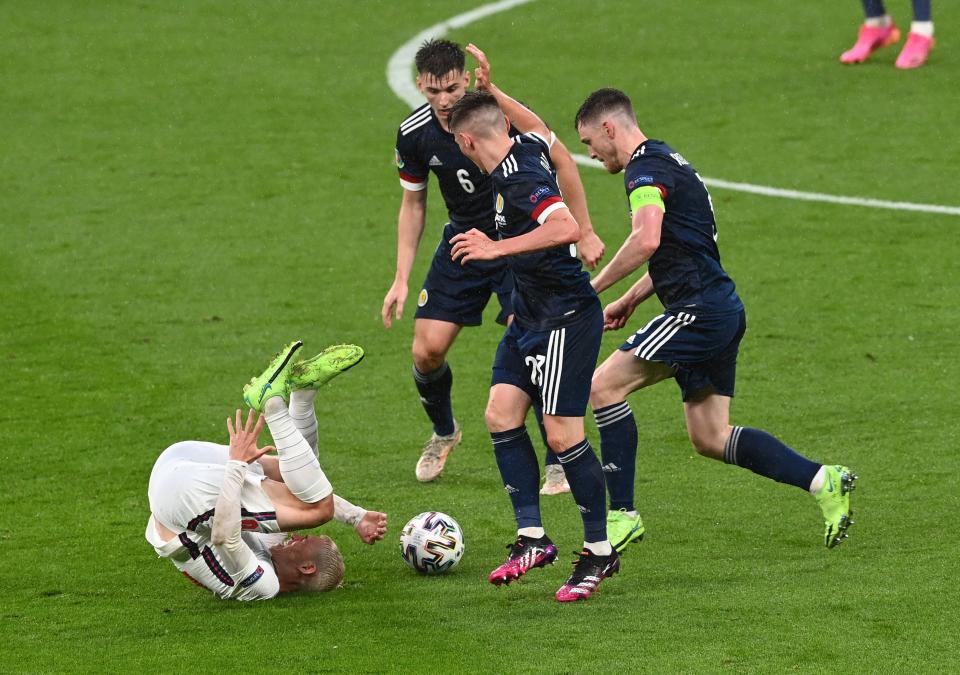 Phil Foden reacts after a challenge (Getty)