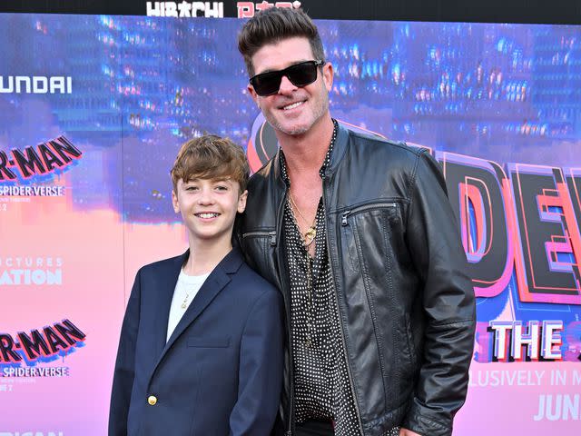 <p>Axelle/Bauer-Griffin/FilmMagic</p> Julian Fuego Thicke and Robin Thicke attend the World Premiere of "Spider-Man: Across the Spider Verse"