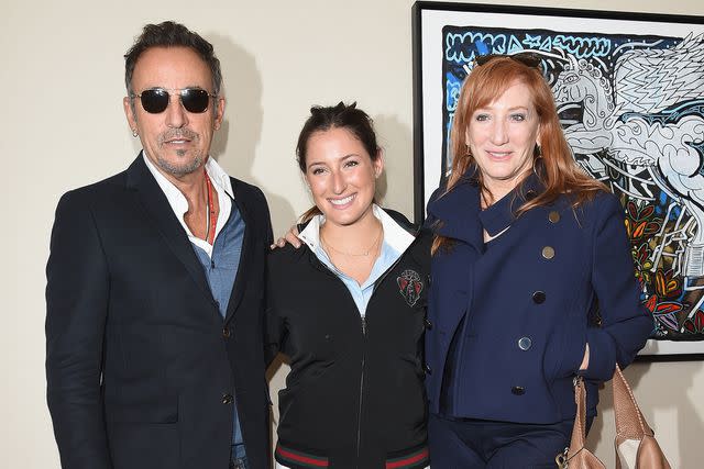 <p>Venturelli/Getty </p> Bruce Springsteen (left) and his wife Patti Scialfa (right) pose with their daughter Jessica Springsteen (center)