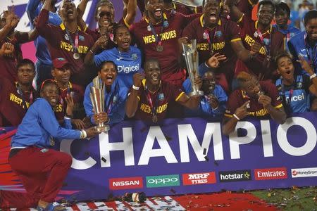 Cricket - England v West Indies - World Twenty20 cricket tournament final - Kolkata, India - 03/04/2016. West Indies men's and women's teams celebrate with their trophies after winning their finals. REUTERS/Rupak De Chowdhuri