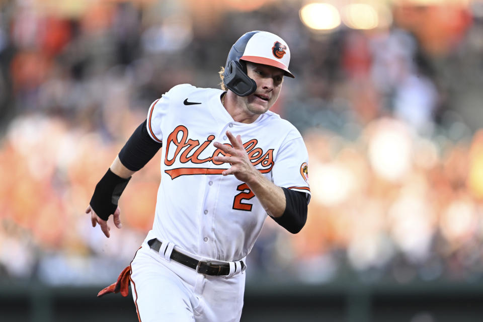 Baltimore Orioles' Gunnar Henderson races to third on a double by Anthony Santander in the first inning of a baseball game against the New York Yankees, Sunday, July 30, 2023, in Baltimore. (AP Photo/Gail Burton)