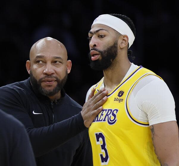 Los Angeles, CA - January 17: Lakers head coach Darvin Ham, left, congratulates Lakers forward Anthony Davis, #3, during their 110-127 win over the Mavericks at Crypto.com Arena in Los Angeles Wednesday, Jan. 17, 2024. Lakers won 110-127. (Allen J. Schaben / Los Angeles Times)