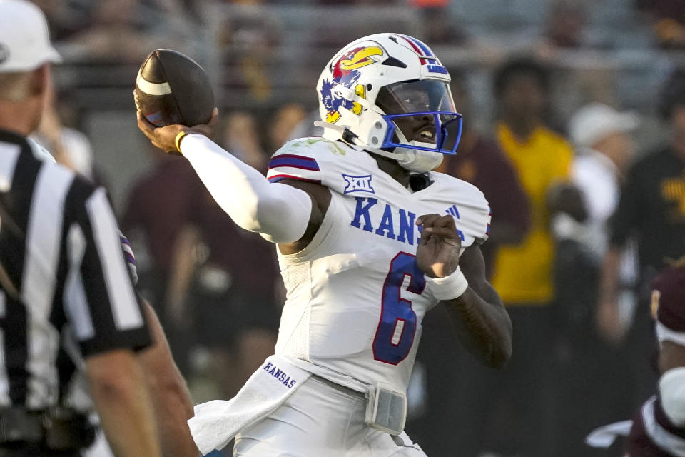 Kansas quarterback Jalon Daniels (6) throws against Arizona State during the first half of an NCAA college football game Saturday, Oct. 5, 2024, in Tempe, Ariz. (AP Photo/Darryl Webb)