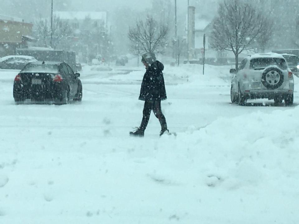 A pedestrian walks at the Mill River professional center in Taunton on Friday morning, Jan. 7, 2022.