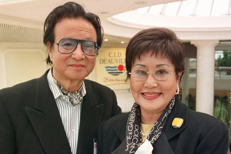 <em>Choi Eun-hee poses with her husband, director Shin Sang-ok, in France in 1999 (AFP)</em>