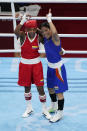 Columbia's Ingrit Lorena Valencia Victoria, left, and India's Chungneijang Mery Kom Hmangte after their women's flyweight 51-kg boxing match at the 2020 Summer Olympics, Thursday, July 29, 2021, in Tokyo, Japan. (AP Photo/Frank Franklin II)