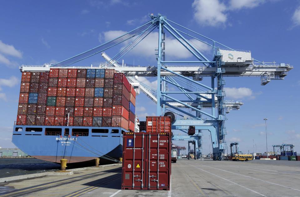 In this March 26, 2014 photo, a stack of containers wait pier side to be loaded on a container ship at the Norfolk International Terminal in Norfolk, Va. The Conference Board reports on its index of leading economic indicators for March on Monday, April 21, 2014. (AP Photo/Steve Helber)