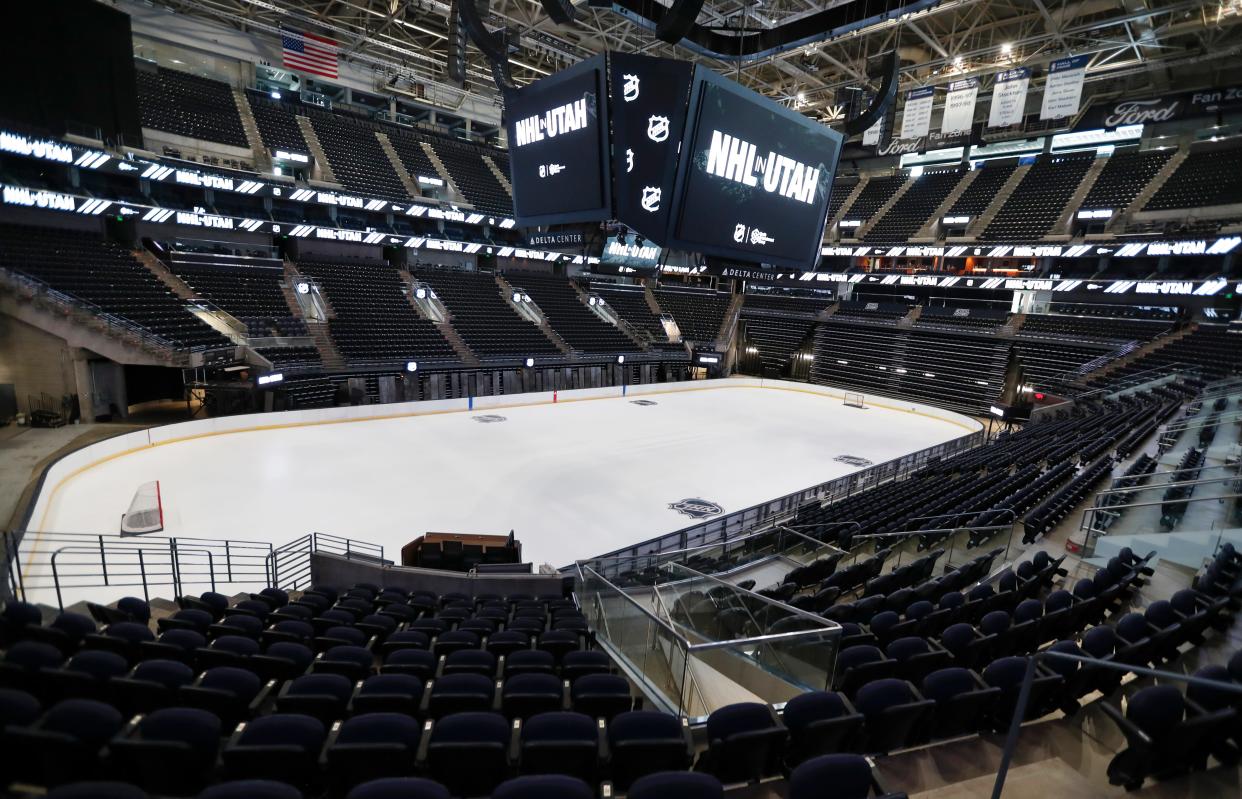 The hockey rink at the Delta Center can be seen with the "NHL in Utah" logos will appear on signage in Salt Lake City on April 19.  The Utah Hockey Club will make its NHL debut with a preseason game in Des Moines in September against the St. Louis Blues.