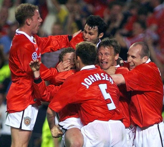 Ole Gunnar Solskjaer, centre left, is mobbed by team-mates after his late Champions League final winner against Bayern Munich in 1999