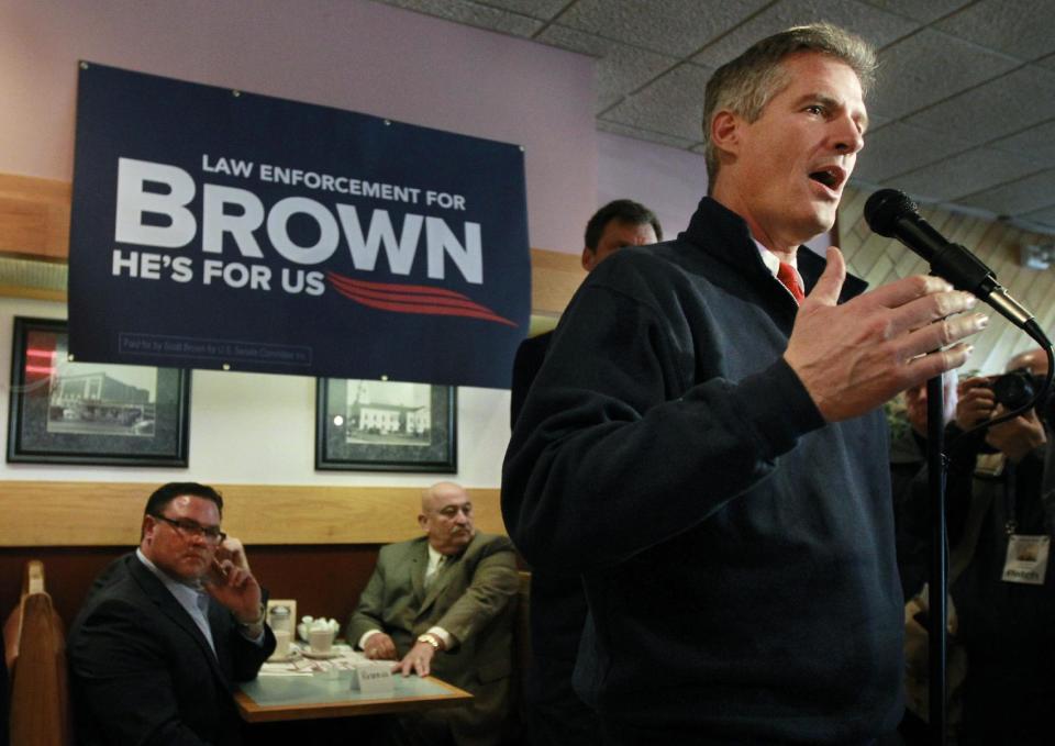 U.S. Sen. Scott Brown, R-Mass., right, addresses an audience during a campaign event at a restaurant, in Milford, Mass., Thursday, Nov. 1, 2012. Brown and Democratic challenger Elizabeth Warren have already spent nearly $68 million pursuing the same U.S. Senate seat, shattering all previous spending records in Massachusetts. (AP Photo/Steven Senne)